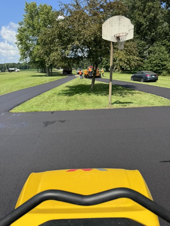 Backyard basketball court paved by Paul's crew